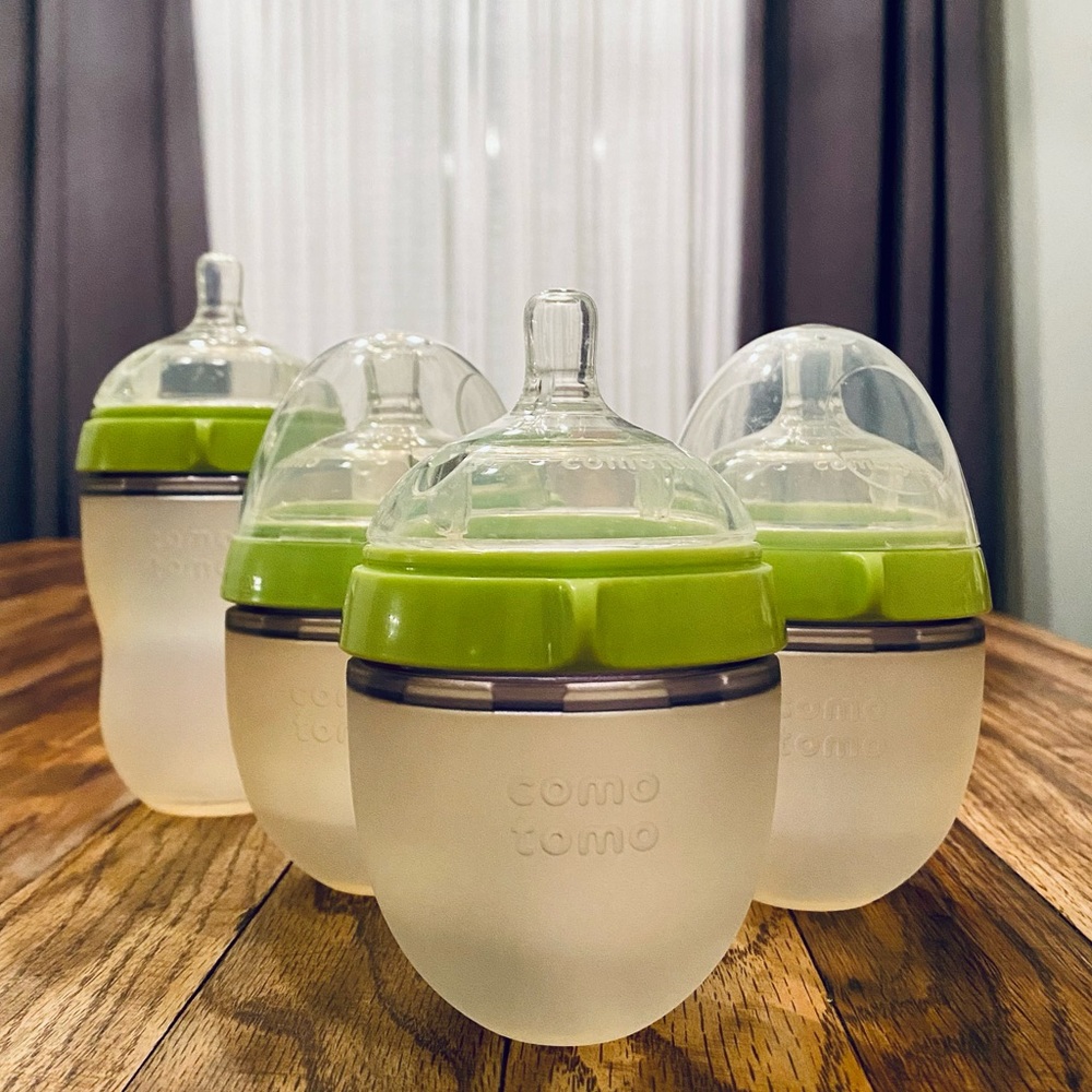 (4) como tomo Bottles
